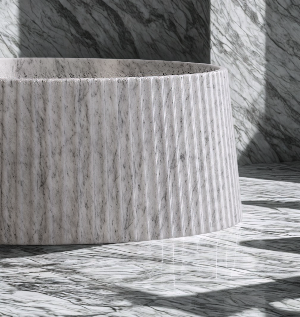 fluted freestanding marble bathtub