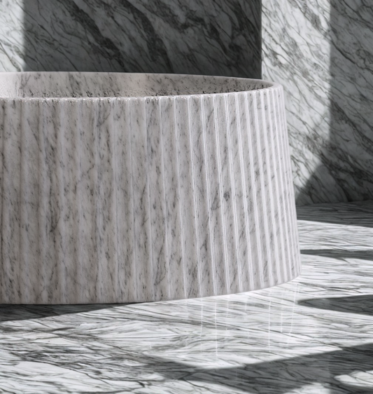 fluted freestanding marble bathtub